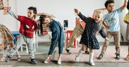 Group of preschoolers dancing and stretching